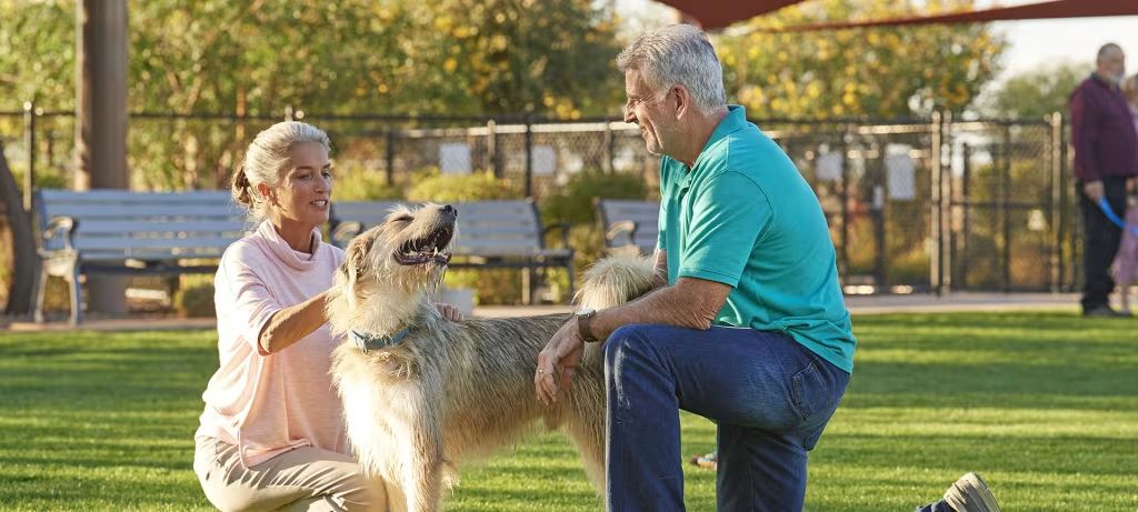 Active adult couple with their dog in an Arizona 55+ community