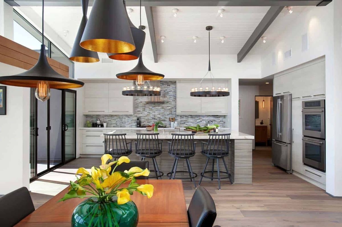 Bright model home kitchen with island seating