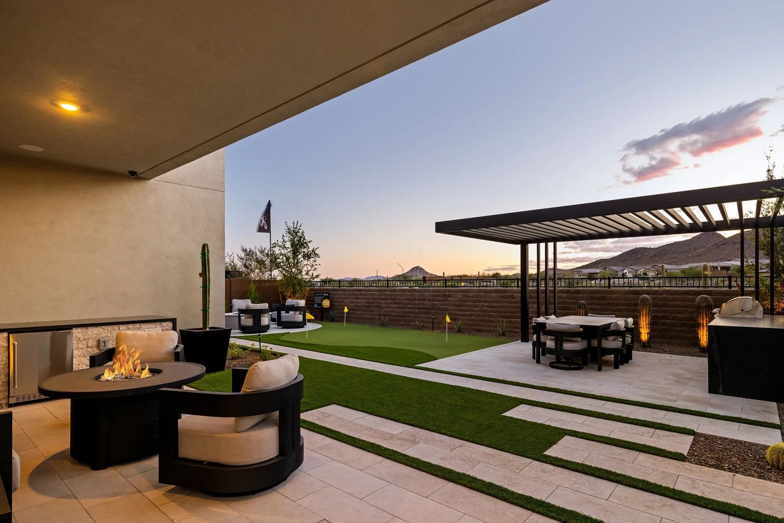 New construction home covered patio at twilight in Peoria, Arizona